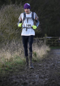 Stu Nicholas surfs the mud in the Queen Elizabeth Spring Marathon