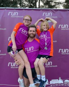 Leon Atkins holding Esmee and Finley at Run Bournemouth