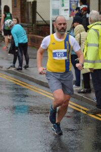 Ian White finishing the Junction Broadstone Quarter Marathon