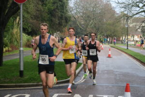 Ollie James and Tag in action in Round the Lakes 10k
