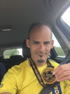 Rich Brawn with medal after Wrexham Elite Marathon