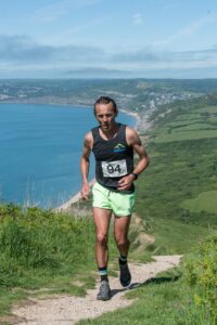 Jacek arrives at the top of Golden Cap