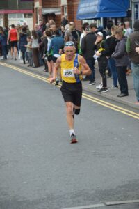 Bill Lennon drives toward the finish in the Junction Broadstone Quarter Marathon