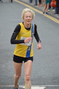 Debbie Lennon finishing the Junction Broadstone Quarter Marathon