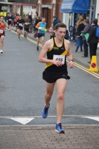 Dom Willmore sealing third in the Junction Broadstone Quarter Marathon