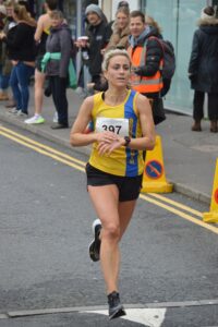 Harriet Slade finishing the Junction Broadstone Quarter Marathon