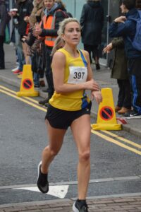 Harriet Slade completing the Junction Broadstone Quarter Marathon