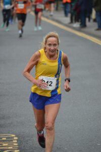 Heather Khoshnevis finishing the Junction Broadstone Quarter Marathon