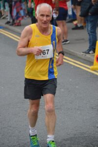 Ian Graham finishing the Junction Broadstone Quarter Marathon
