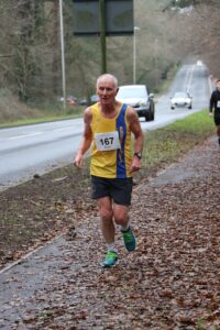 Ian Graham heading up Gravel Hill in the Junction Broadstone Quarter Marathon
