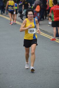 Lea Lohk finishing the Junction Broadstone Quarter Marathon