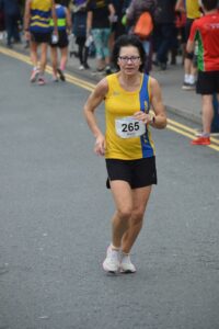 Lea Lohk completing the Junction Broadstone Quarter Marathon