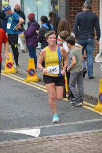 Louise Price finishes the Junction Broadstone Quarter Marathon