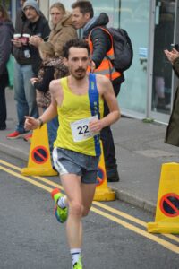 Luke Jackson completing the Junction Broadstone Quarter Marathon