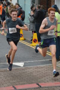 Oliver Hill finishing the Junction Broadstone Quarter Marathon