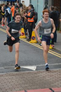 Oliver Hill crosses the line in the Junction Broadstone Quarter Marathon