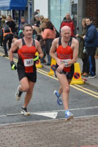Paul Bullimore and Bruce Campbell finishing the Junction Broadstone Quarter Marathon