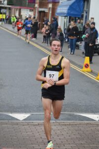 Thomas Corbin taking second in the Junction Broadstone Quarter Marathon