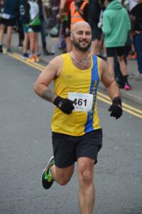 Wayne Walford Jelks finishing the Junction Broadstone Quarter Marathon