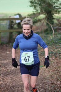 Helen Ambrosen enjoying her run in the Up on the Downs 10k