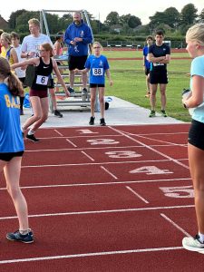 Esmee Hurst Atkins picks up the baton in the BAC Mile of Miles Relay