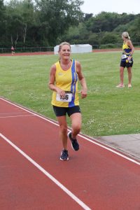 Caroline Rowley comes in to complete the race