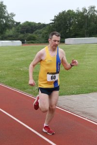 David Crowther crosses the line