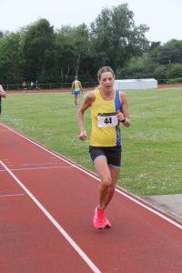 Emma Caplan finishing the May 5