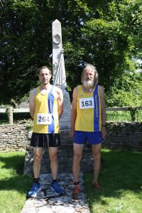 Ricky Brennan and Geoff Newton in front of the monument