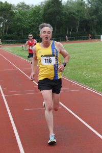 Tim Hughes arrives at the finish