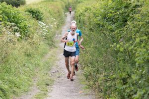 Geoff Newton races down the path in the Giants Head Half Marathon