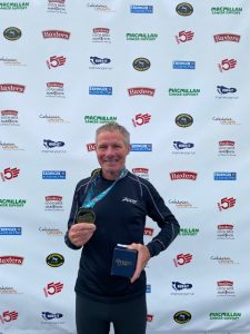 Nick Kenchington with his medal and prize from the Loch Ness Marathon