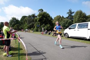 Hayley Weston finishing first female at the Exbury Gardens 10k