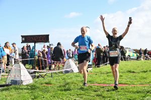 Clint Taylor and Zoe Meaton cross the line in Run to the Sea