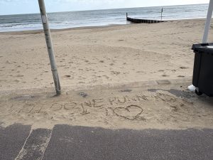 Some encouraging writing in the sand on the prom