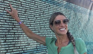 Emma Caplan finding her name on the list at the IRONMAN 70.3 World Championships expo in Marbella
