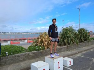 Dave Newman on the podium after winning Weymouth Half Marathon