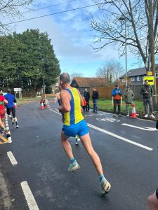 Rich Brawn heading along the road in the Wokingham Half Marathon