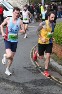 Adam Corbin giving his all in the Fleet Half Marathon