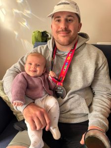 Ashley White with his medal after the Brighton Marathon
