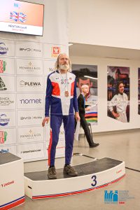 Geoff Newton on the third step of the podium for 3000m race