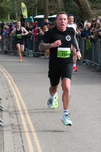 Mike Akers heading down the home straight in the Fleet Half Marathon 