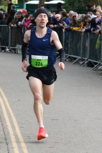 Rob McTaggart racing toward the finish in the Fleet Half Marathon