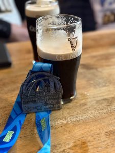 Paddy McCalister's Belfast City Marathon medal & pint of Guiness