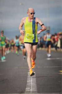 Barry Dolman checking his watch in the Cape Town Marathon