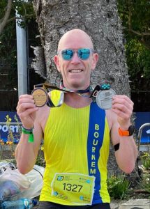 Barry with his Cape Town Marathon and Age Group World Championship medals