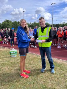 Emma Caplan collects her prizes for third female and first in the 45 to 54 category
