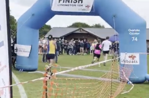 Jason Christian crossing the finish line of the Lymington Lifeboat 10k