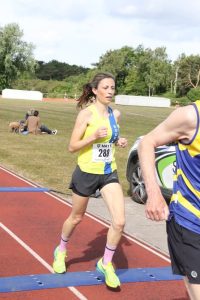 Kate Bowers finishing the May 5