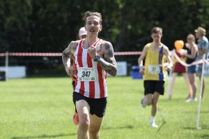 Jack Barwick in the background at the Alresford 10k